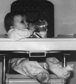 Megan (9 months) in a high chair without her Travelbud